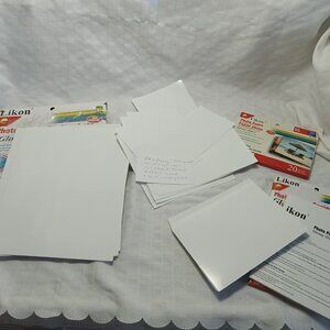 Large batch of photo paper in various sizes, opened and new packages